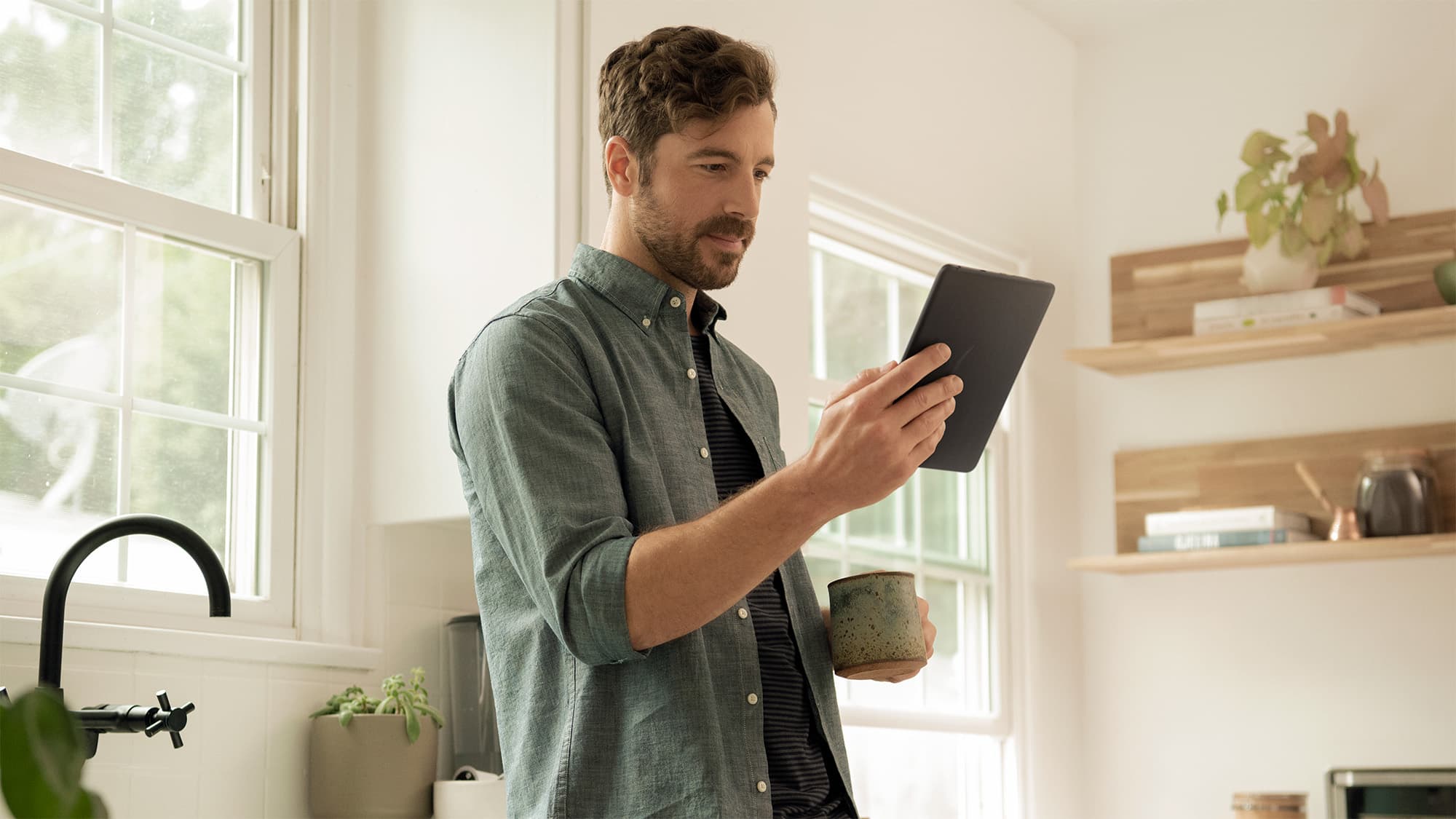 Person using a Fire HD 8 tablet at home